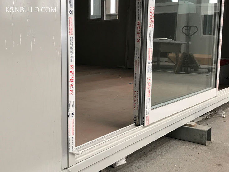 A sliding glass door of a container home.