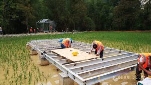 The foundation for the "Loft Mirror" is set among the rice fields of Asia. This will be an amazing getaway, constructed in record time.
