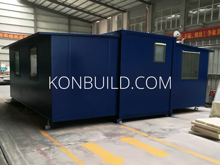 The rear 3/4 view of the shipping container home being built.