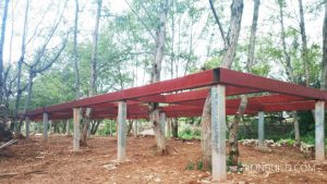 A foundation is complete for a prefabricated resort building.